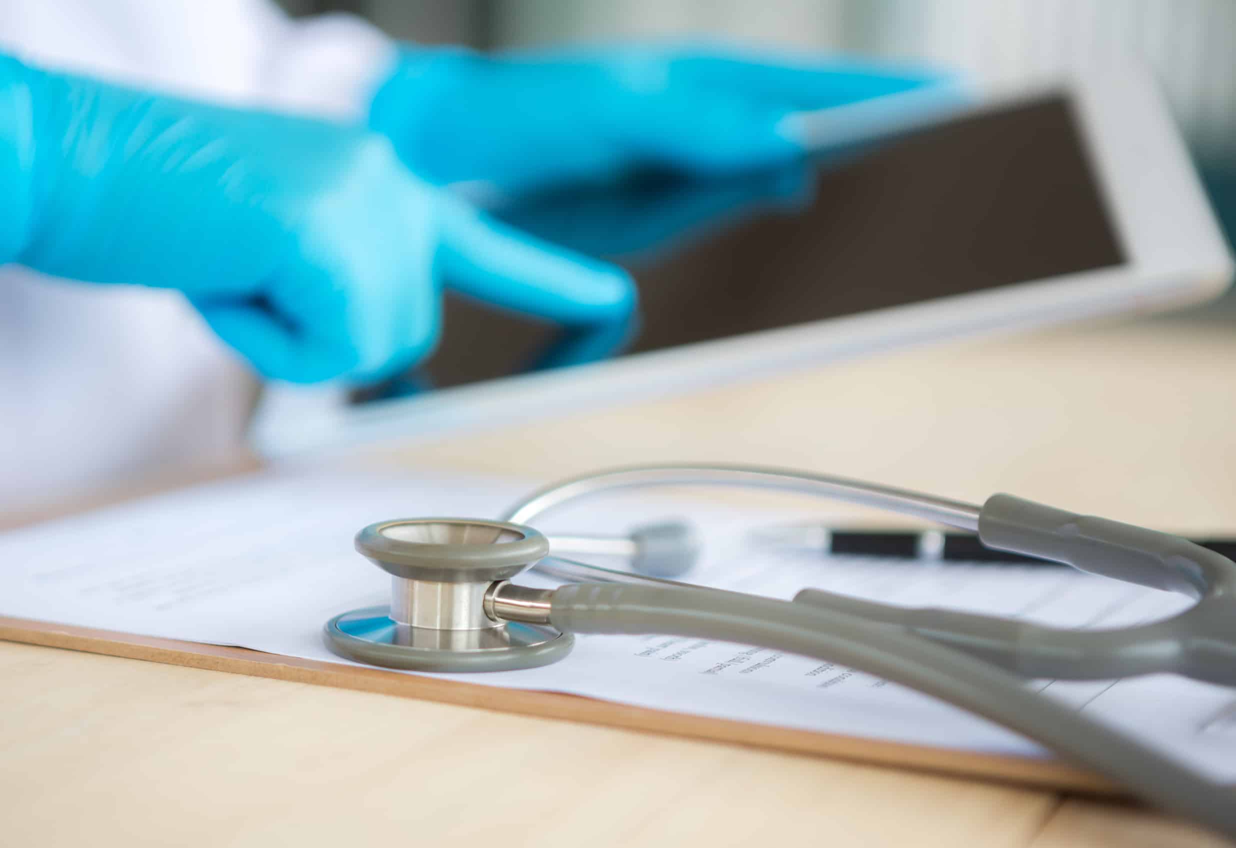 Doctor using tablet computer