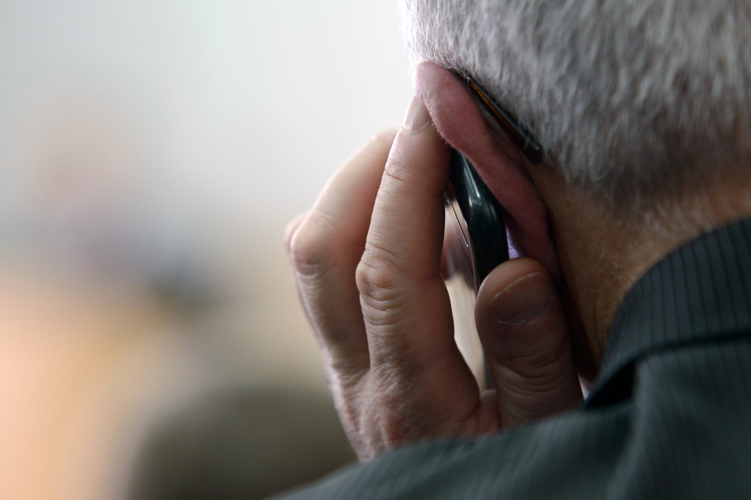 Senior man talking on telephone
