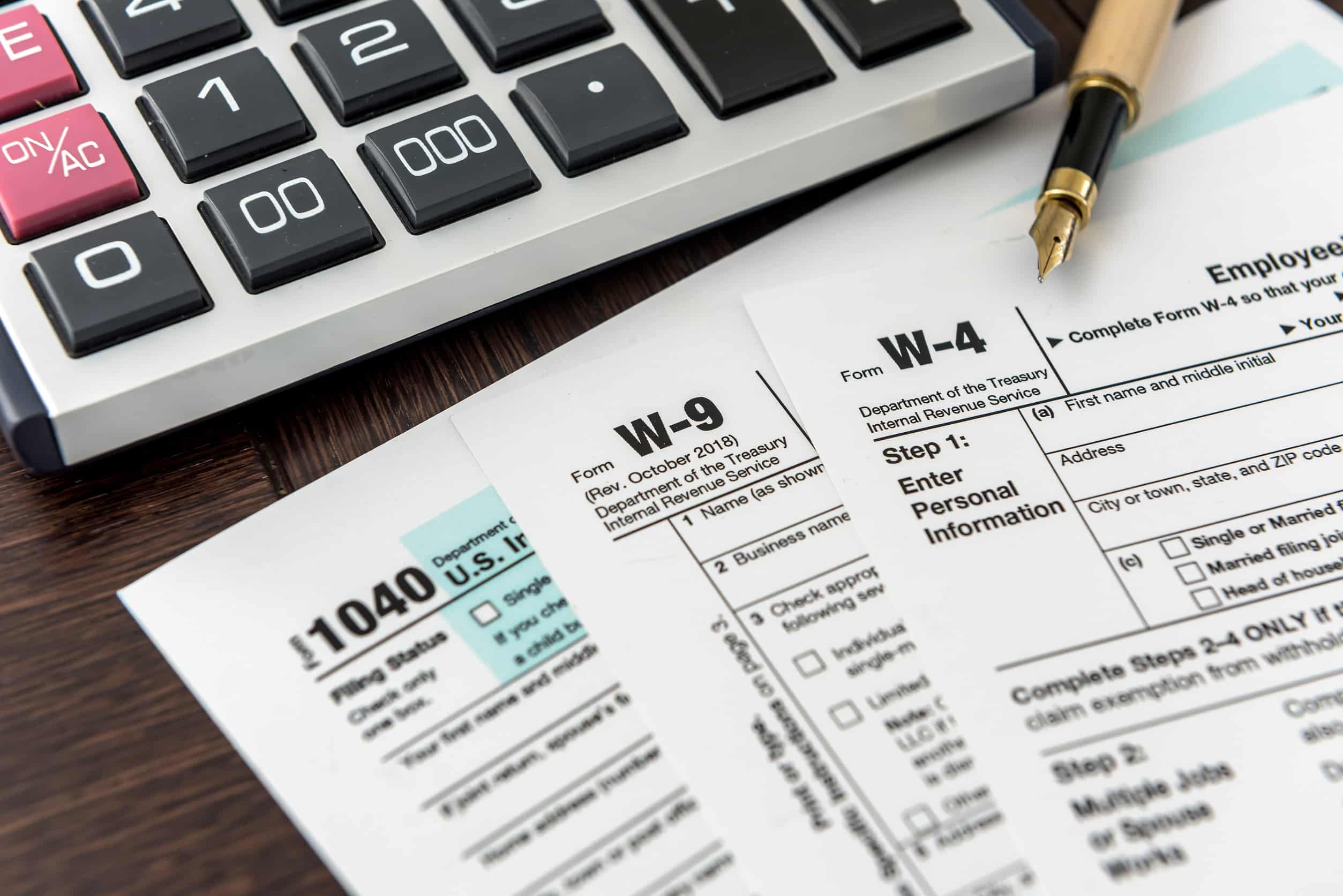 Tax Forms with Calculator and Pen