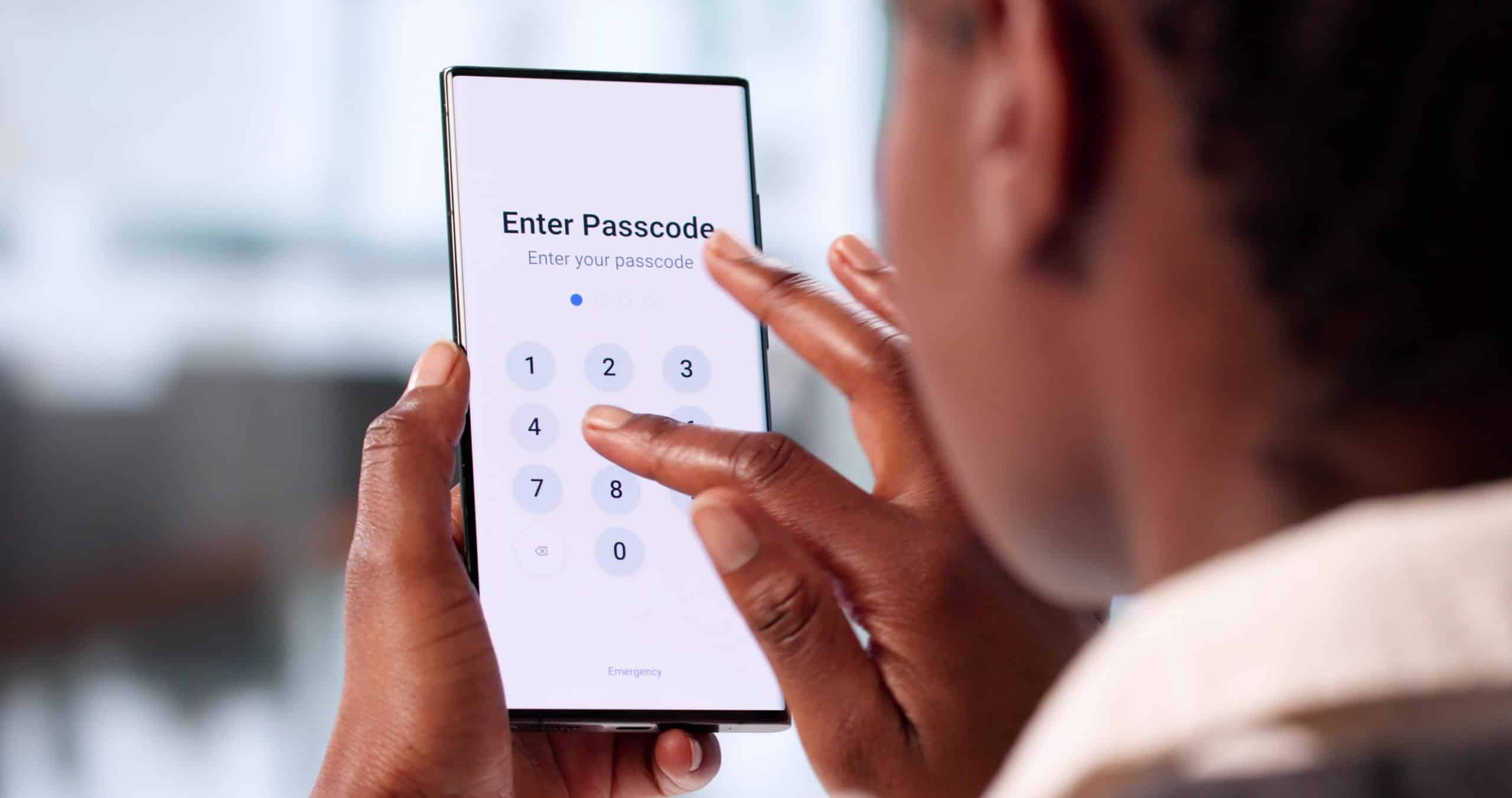 Woman enters passcode on phone